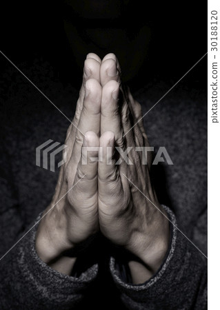 man praying with his hands put together man praying with his hands put together 30188120