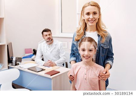 Attractive mother posing with her daughter Attractive mother posing with her daughter 30189134