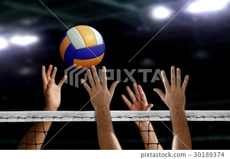 Volleyball spike hand block over the net Volleyball spike hand block over the net 30189374