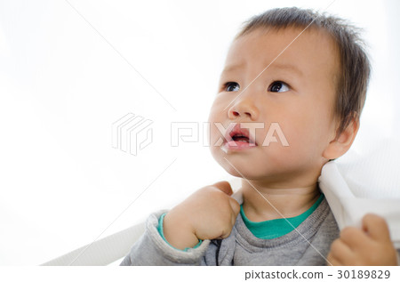 Baby playing with curtain 30189829