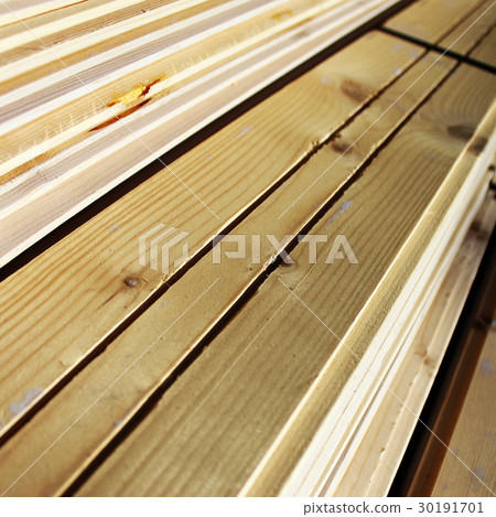 Pile of new wooden boards at construction site 30191701