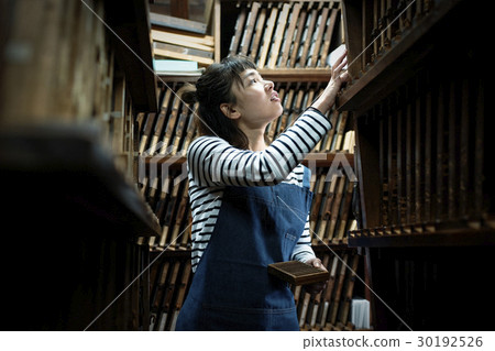 A woman in a craftwork warehouse 30192526