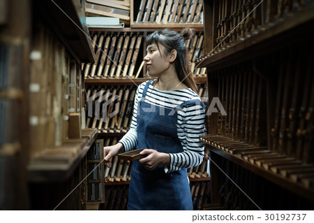 A woman in a craftwork warehouse 30192737