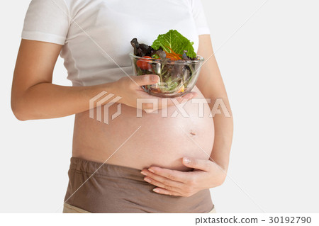 Pregnant woman's belly and vegetable 30192790
