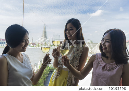Beautiful girls enjoying the champagne at restaurant 30193598