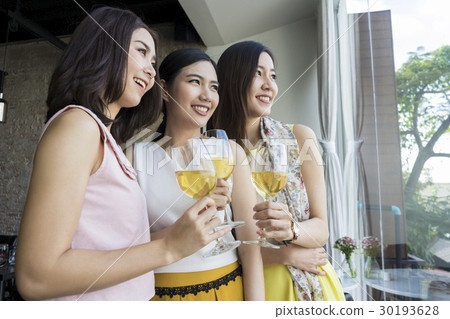 Ladies are enjoying champagne in a luxury restaurant 30193628