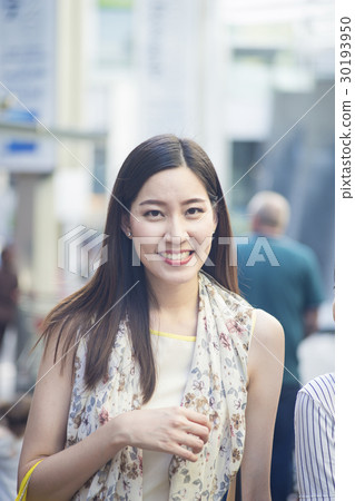 Portrait of a smiling beautiful woman in the street. Portrait of a smiling beautiful woman in the street. 30193950