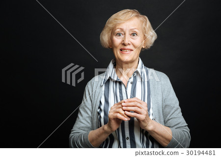 Surprised senior woman expressing emotions in the Surprised senior woman expressing emotions in the 30194481