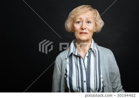 Disappointed pensioner demonstrating sadness in Disappointed pensioner demonstrating sadness in 30194482