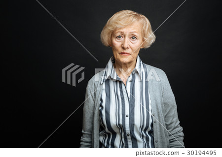 Pitiful aging woman demonstrating comparison 30194495