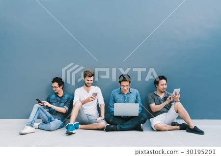 Multiethnic group of men using IT gadget devices Multiethnic group of men using IT gadget devices 30195201