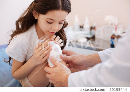 Nice pretty girl looking at her wound 30195444