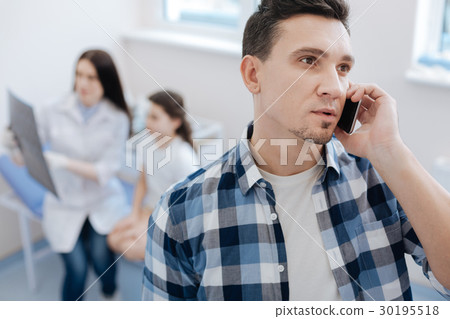 Serious nice man talking on the phone Serious nice man talking on the phone 30195518