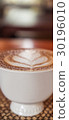Cup of coffee with beautiful Latte art 30196010