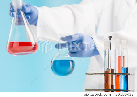 Experiments in a chemistry lab. conducting an Experiments in a chemistry lab. conducting an 30196432