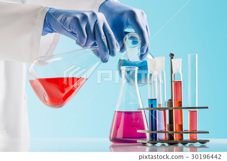 Experiments in a chemistry lab. conducting an Experiments in a chemistry lab. conducting an 30196442