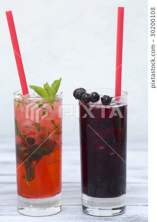 Two glasses of summer drink with ice on wood 30200108