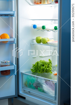 Open refrigerator full of food on kitchen 30200671