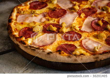 Pizza with ham, sausages and chicken on wood Pizza with ham, sausages and chicken on wood 30201405