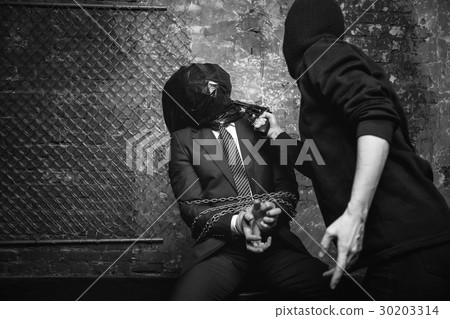 Vicious cruel kidnapper making sure the victim Vicious cruel kidnapper making sure the victim 30203314