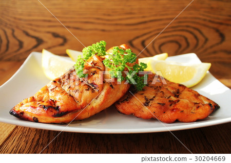 Grilled chicken breast served on plate with Grilled chicken breast served on plate with 30204669