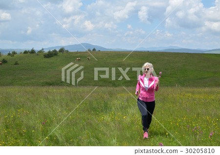 Woman Running in Countryside Woman Running in Countryside 30205810