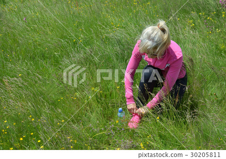 Woman Preparing for Sport Activity Woman Preparing for Sport Activity 30205811