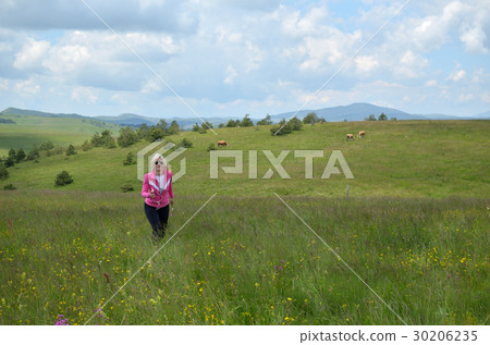 Woman Running over Hills on Cloudy Day Woman Running over Hills on Cloudy Day 30206235