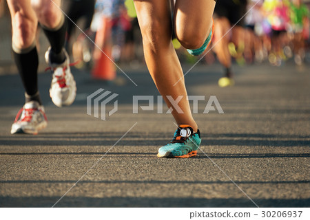 Marathon running in the light of evening 30206937
