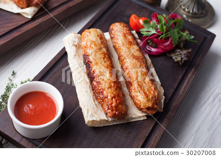 Kebab on wooden board with sauce still life on top 30207008