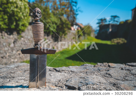 sword in stone near castle sword in stone near castle 30208298