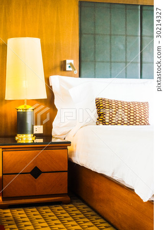Pillow on bed with light lamp Pillow on bed with light lamp 30214327
