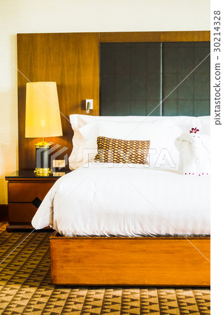 Pillow on bed with light lamp Pillow on bed with light lamp 30214328
