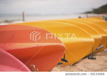 Kayaks on the beach during the day 30214888