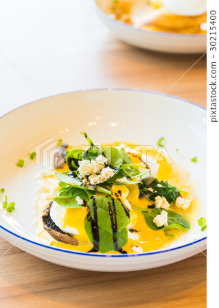 Mushroom and egg benedict in white plate Mushroom and egg benedict in white plate 30215400