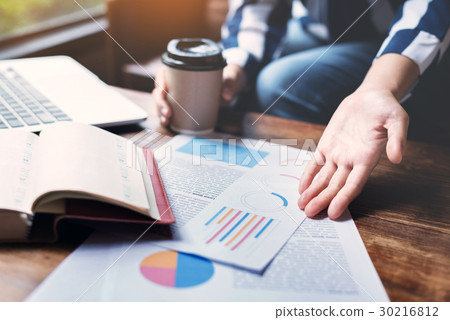 Business woman hands holding cup of coffee. Business woman hands holding cup of coffee. 30216812