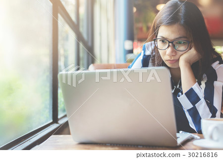 Asian Woman thinking about her work Asian Woman thinking about her work 30216816