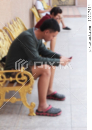blur man using smart phone in the park. blur man using smart phone in the park. 30217454