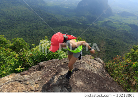 woman trail runner running at mountain top 30218805