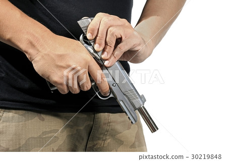 Man hold and loading ammunition. 30219848