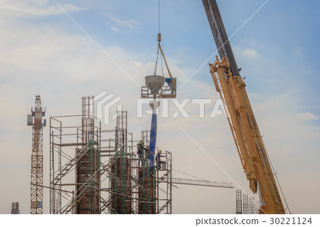 Construction workers working on scaffolding  30221124