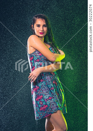 Young beautiful woman under splash of rain 30222074