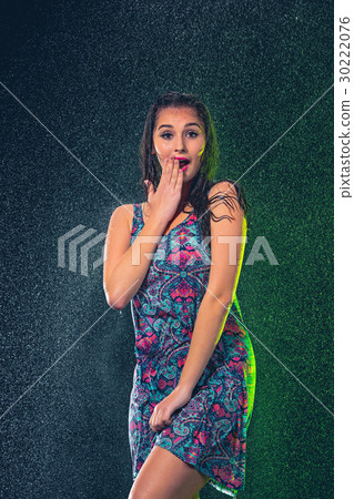 Young beautiful woman under splash of rain 30222076