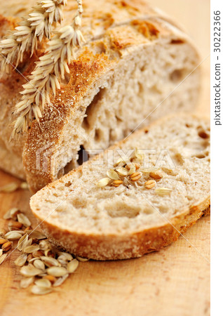Close-up on traditional bread on wooden board Close-up on traditional bread on wooden board 30222366