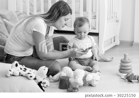 Image of young mother playing with her baby 30225150