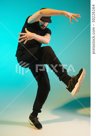 The silhouette of one hip hop male break dancer 30226164