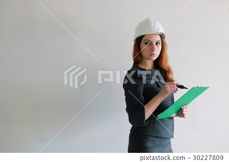 female architect at the construction site 30227809
