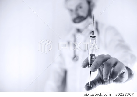 Crazy doctor in a white coat and old syringe Crazy doctor in a white coat and old syringe 30228307