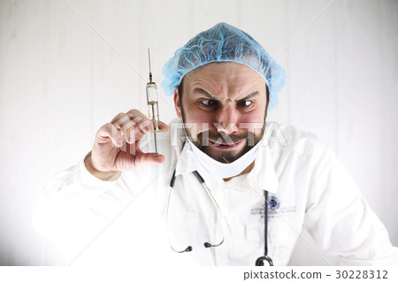 Crazy doctor in a white coat and old syringe Crazy doctor in a white coat and old syringe 30228312