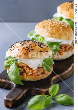 Homemade mini burgers with pulled chicken Homemade mini burgers with pulled chicken 30228371